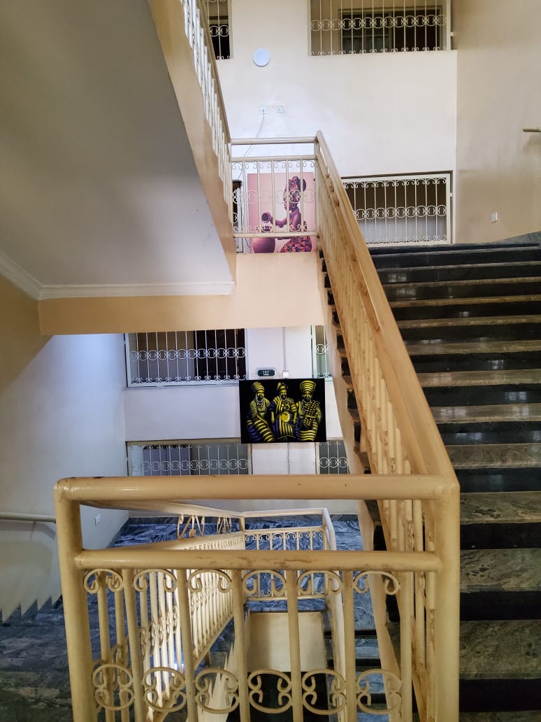Hospital interior stairwell with cultural artwork